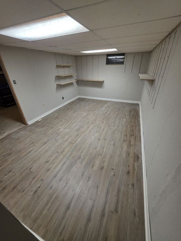 Same basement with new luxury vinyl plank flooring