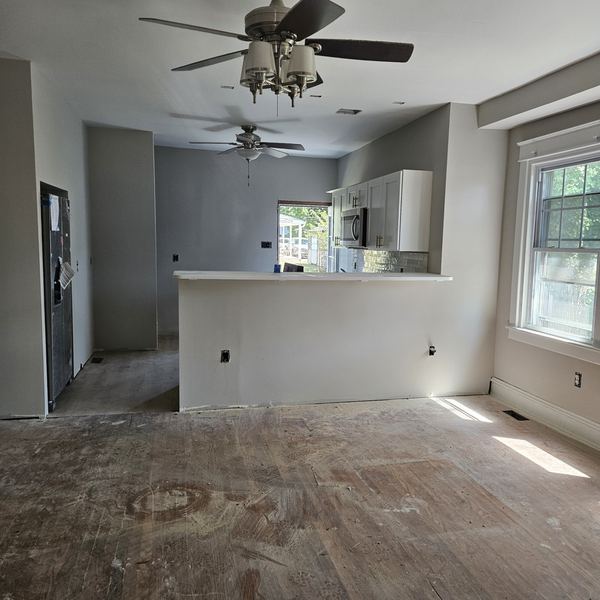 Open-plan kitchen and dining area after the rowhome renovation