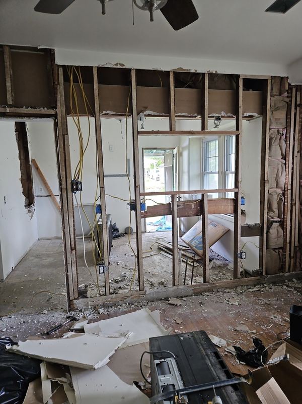 Interior wall opened to the studs during a rowhome kitchen renovation
