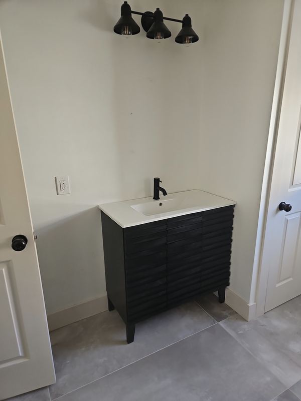 New bathroom vanity, fixtures and lighting